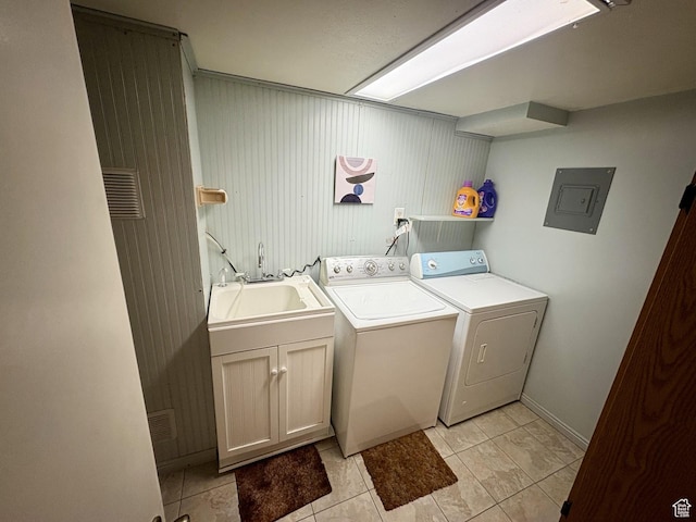 391 N 100 W, Delta, UT 84624 - laundry area featuring washer and clothes dryer, electric panel, light tile patterned flooring, cabinet space, and baseboards
