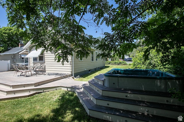 1438 E Woodland Ave S, Millcreek, UT 84106 - wooden deck featuring a hot tub, outdoor dining area, and a yard