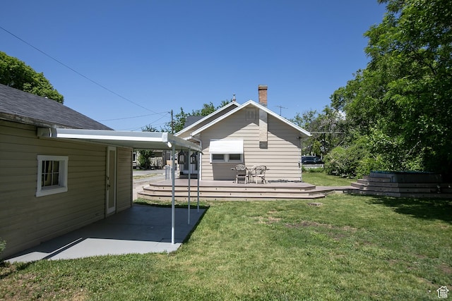 1438 E Woodland Ave S, Millcreek, UT 84106 - back of property featuring a chimney, a yard, and a patio