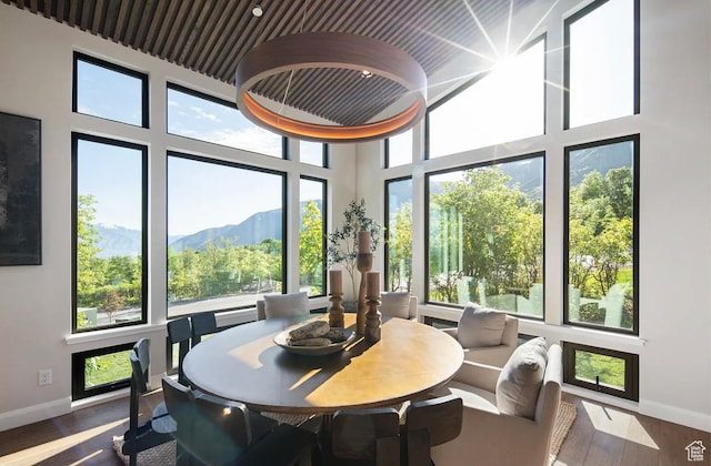 1040 S Summit Creek Dr, Woodland Hills, UT 84653 - dining room featuring baseboards, wood finished floors, a mountain view, and a high ceiling