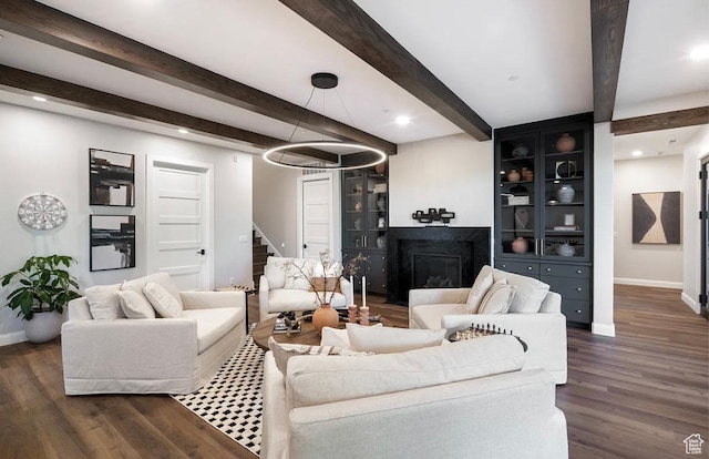 1040 S Summit Creek Dr, Woodland Hills, UT 84653 - living room with baseboards, stairs, beam ceiling, dark wood-type flooring, and a glass covered fireplace