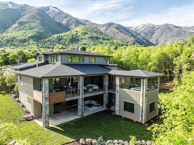 1040 S Summit Creek Dr, Woodland Hills, UT 84653 - rear view of house with a patio, a yard, a mountain view, and a shingled roof