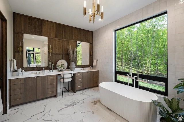 1040 S Summit Creek Dr, Woodland Hills, UT 84653 - full bath with vanity, a freestanding bath, tile walls, a chandelier, and marble finish flooring