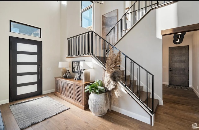 1040 S Summit Creek Dr, Woodland Hills, UT 84653 - entrance foyer with a high ceiling, baseboards, stairs, and healthy amount of natural light