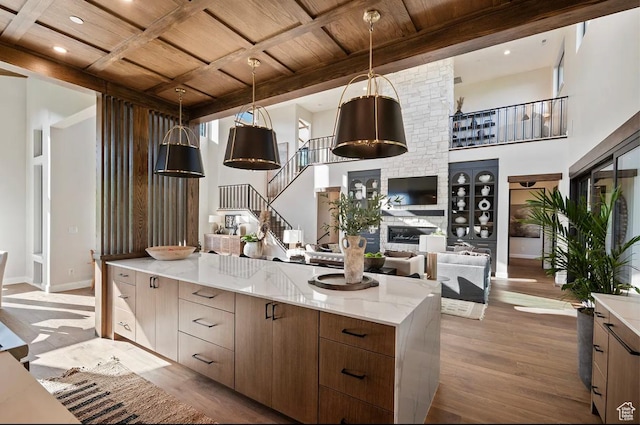 1040 S Summit Creek Dr, Woodland Hills, UT 84653 - kitchen featuring wood ceiling with exposed beams, wood finished floors, modern cabinets, baseboards, and recessed lighting