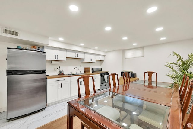 5151 S 2275 W, Roy, UT 84067 - dining room with recessed lighting and light marble finish flooring