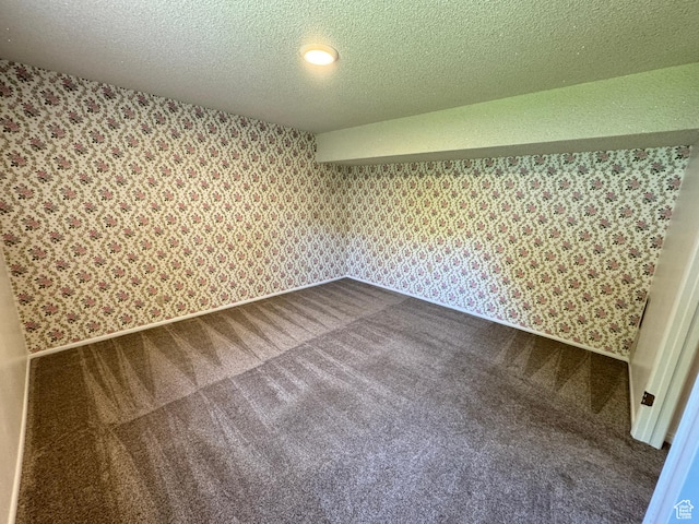 6209 W 9600 N, Highland, UT 84003 - additional living space featuring wallpapered walls, dark carpet, and a textured ceiling