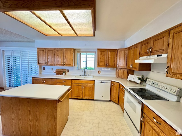 6209 W 9600 N, Highland, UT 84003 - kitchen with white appliances, under cabinet range hood, a sink, light floors, and brown cabinets
