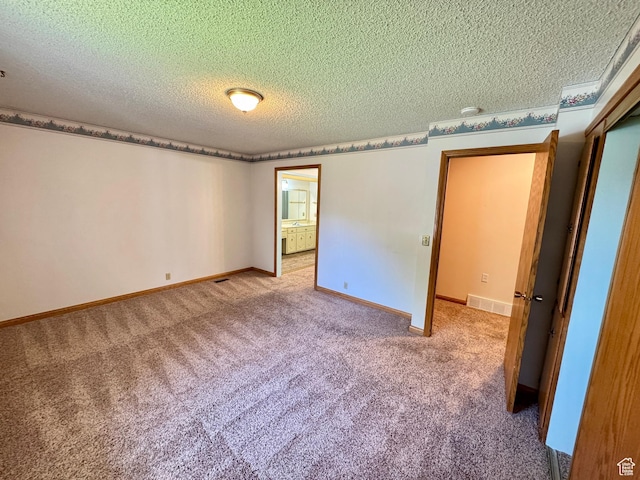 6209 W 9600 N, Highland, UT 84003 - empty room featuring light colored carpet, a textured ceiling, and baseboards