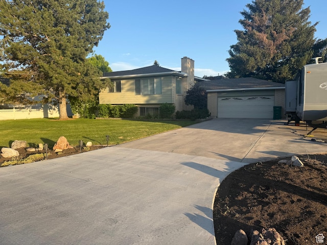 6209 W 9600 N, Highland, UT 84003 - split level home featuring a chimney, driveway, and a front lawn