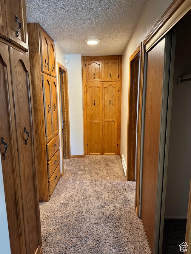 6209 W 9600 N, Highland, UT 84003 - corridor with carpet flooring, a textured ceiling, and baseboards