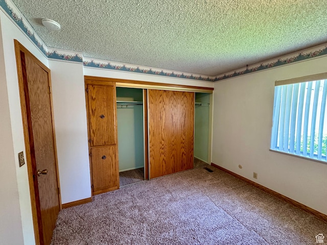 6209 W 9600 N, Highland, UT 84003 - unfurnished bedroom with a textured ceiling, a closet, and carpet