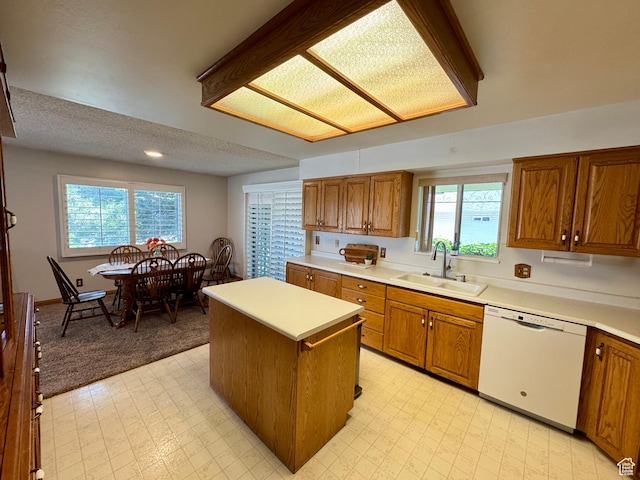 6209 W 9600 N, Highland, UT 84003 - kitchen featuring white dishwasher, a sink, brown cabinets, recessed lighting, and a textured ceiling