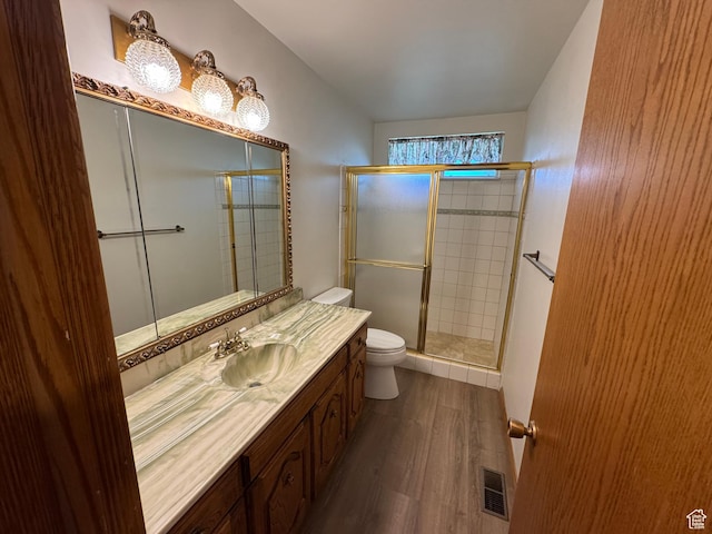 6209 W 9600 N, Highland, UT 84003 - bathroom with toilet, wood finished floors, vanity, and a shower stall