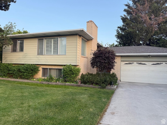 6209 W 9600 N, Highland, UT 84003 - split level home with a chimney, brick siding, driveway, and a front lawn