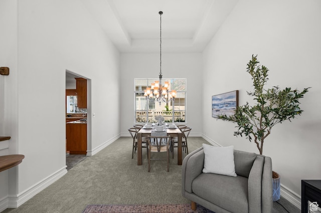 2607 E Cruise Bay Ct Unit 406, Cottonwood Heights, UT 84121 - carpeted dining space featuring a chandelier, a towering ceiling, a raised ceiling, and baseboards