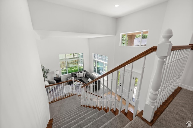 2607 E Cruise Bay Ct Unit 406, Cottonwood Heights, UT 84121 - staircase with plenty of natural light, baseboards, wood finished floors, a high ceiling, and recessed lighting