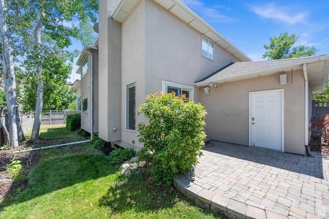 2607 E Cruise Bay Ct Unit 406, Cottonwood Heights, UT 84121 - view of home's exterior with stucco siding and a patio area