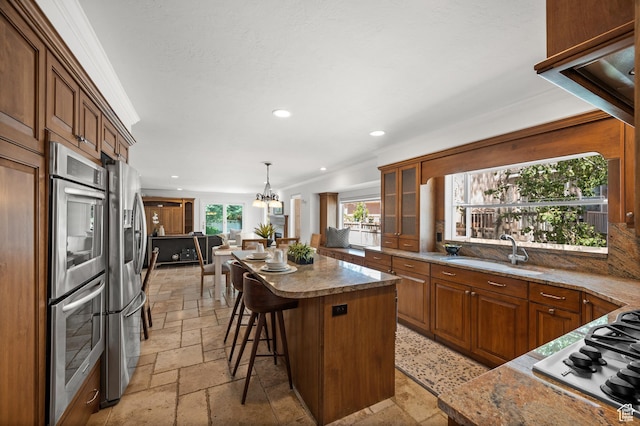 2607 E Cruise Bay Ct Unit 406, Cottonwood Heights, UT 84121 - kitchen featuring stone tile flooring, a sink, appliances with stainless steel finishes, a kitchen island, and recessed lighting