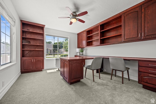 2607 E Cruise Bay Ct Unit 406, Cottonwood Heights, UT 84121 - office area with built in desk, ceiling fan, light carpet, and baseboards