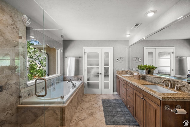 2607 E Cruise Bay Ct Unit 406, Cottonwood Heights, UT 84121 - full bathroom featuring plenty of natural light, french doors, a garden tub, and double vanity