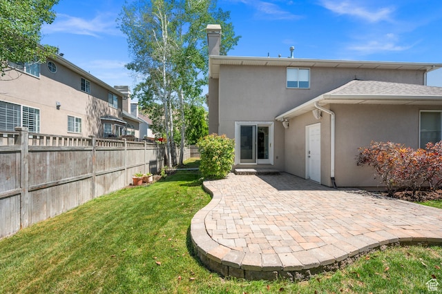 2607 E Cruise Bay Ct Unit 406, Cottonwood Heights, UT 84121 - rear view of property with stucco siding, a patio area, and a chimney