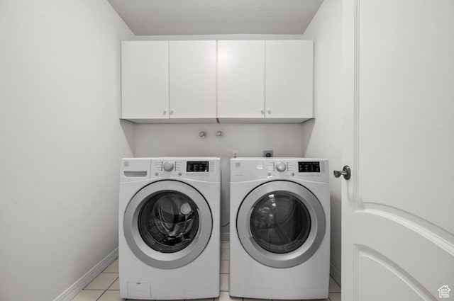 2607 E Cruise Bay Ct Unit 406, Cottonwood Heights, UT 84121 - washroom featuring cabinet space, washing machine and dryer, baseboards, and light tile patterned flooring