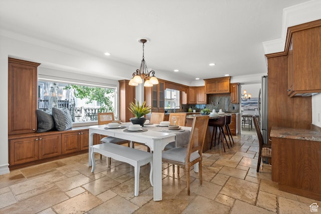 2607 E Cruise Bay Ct Unit 406, Cottonwood Heights, UT 84121 - dining area featuring stone tile flooring, recessed lighting, crown molding, and a chandelier