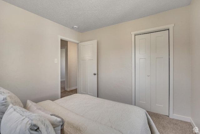 4401 W 5655 S, Salt Lake City, UT 84118 - carpeted bedroom with baseboards, a closet, and a textured ceiling