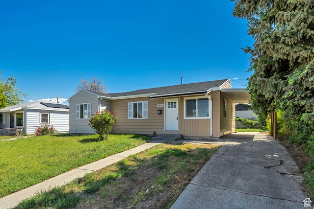 4401 W 5655 S, Salt Lake City, UT 84118 - view of front facade with an attached carport, a front lawn, and concrete driveway