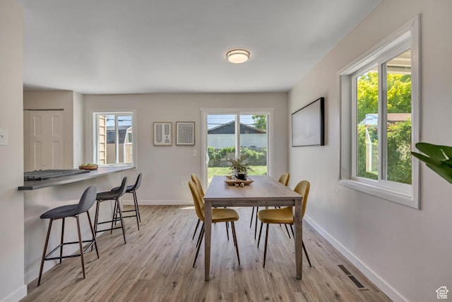 4401 W 5655 S, Salt Lake City, UT 84118 - dining room with light wood-type flooring, baseboards, and plenty of natural light