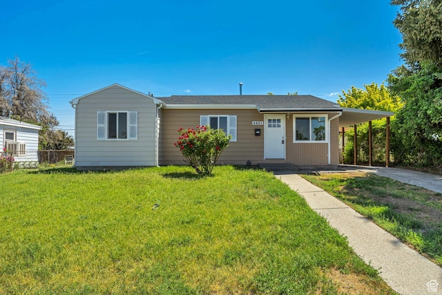 4401 W 5655 S, Salt Lake City, UT 84118 - view of front facade featuring driveway, a carport, a front yard, and entry steps
