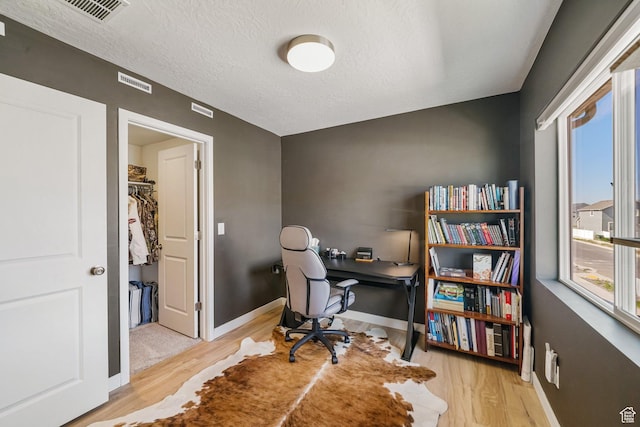 3493 N Sparrow Ln, Eagle Mountain, UT 84005 - office with wood finished floors and a textured ceiling
