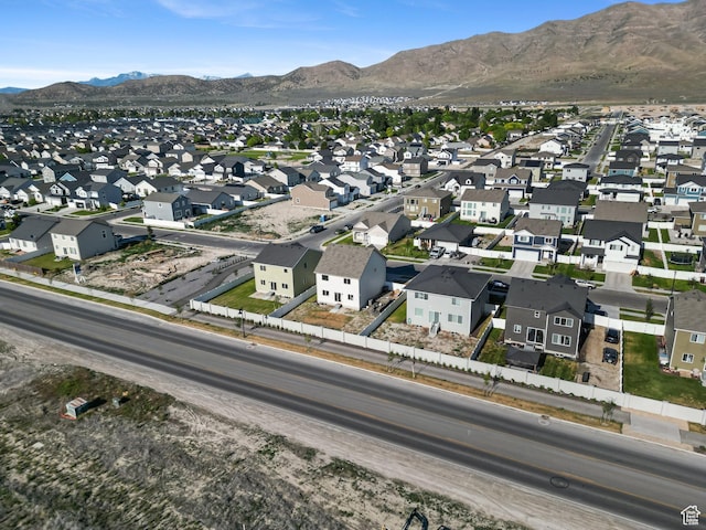 3493 N Sparrow Ln, Eagle Mountain, UT 84005 - aerial view of property and surrounding area featuring nearby suburban area and a mountainous background