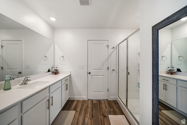 3493 N Sparrow Ln, Eagle Mountain, UT 84005 - full bathroom featuring wood finished floors, vanity, a shower stall, and recessed lighting