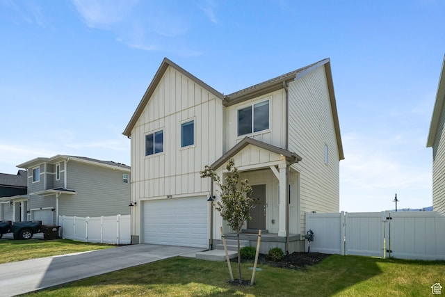 3493 N Sparrow Ln, Eagle Mountain, UT 84005 - view of front of property featuring board and batten siding, a gate, an attached garage, and driveway