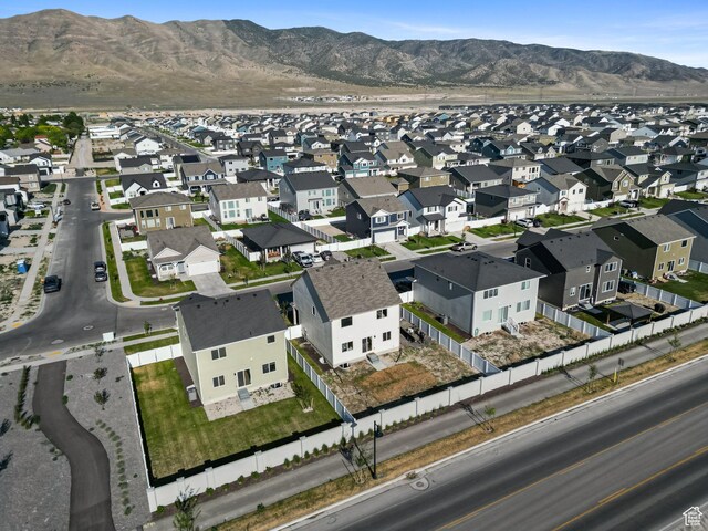 3493 N Sparrow Ln, Eagle Mountain, UT 84005 - aerial view of property and surrounding area featuring nearby suburban area and mountains
