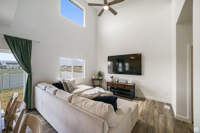 3493 N Sparrow Ln, Eagle Mountain, UT 84005 - living area with ceiling fan, wood finished floors, and a towering ceiling