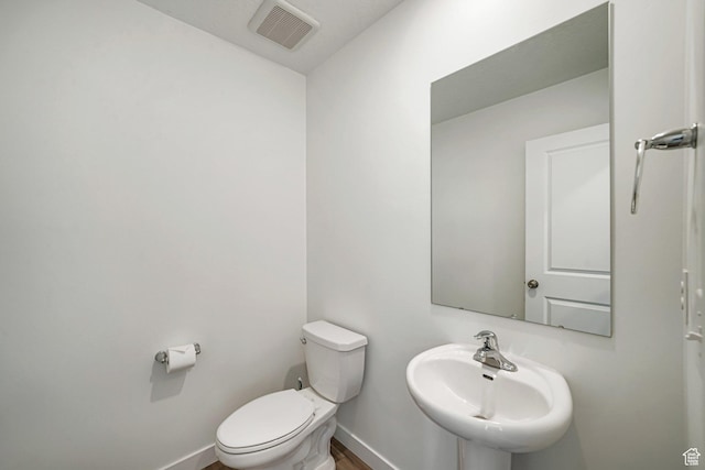 3493 N Sparrow Ln, Eagle Mountain, UT 84005 - half bathroom featuring a sink and wood finished floors