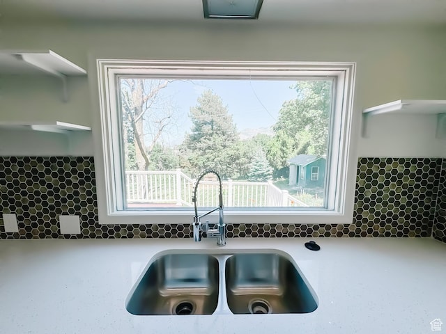 1516 E 36th, Ogden, UT 84403 - kitchen featuring a sink, tasteful backsplash, plenty of natural light, and light countertops