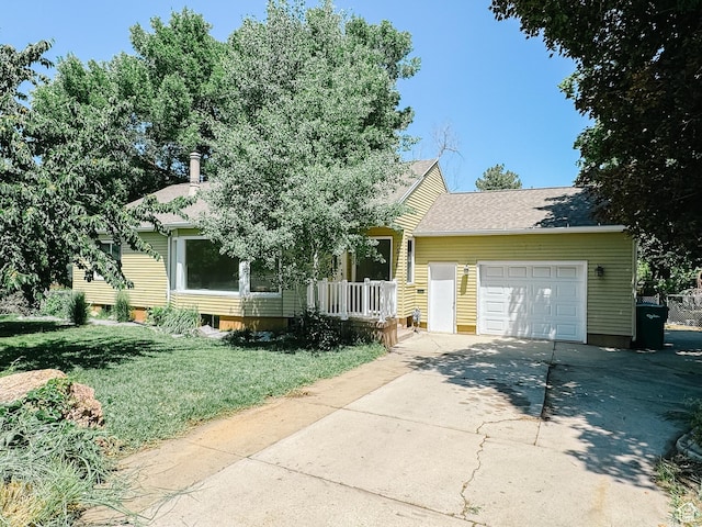 1516 E 36th, Ogden, UT 84403 - view of property hidden behind natural elements with driveway, a garage, and a front yard