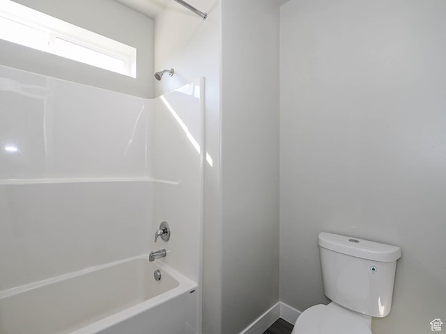 14654 S Bloom Dr W Unit K 304, Herriman, UT 84096 - bathroom with washtub / shower combination, toilet, and baseboards