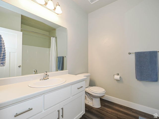 14654 S Bloom Dr W Unit K 304, Herriman, UT 84096 - full bathroom featuring vanity, baseboards, wood finished floors, toilet, and curtained shower