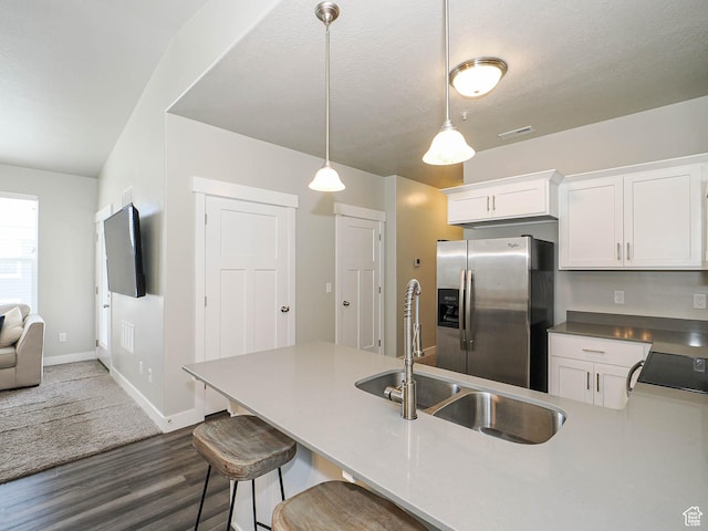 14654 S Bloom Dr W Unit K 304, Herriman, UT 84096 - kitchen featuring stainless steel fridge, dark wood finished floors, white cabinets, and stove