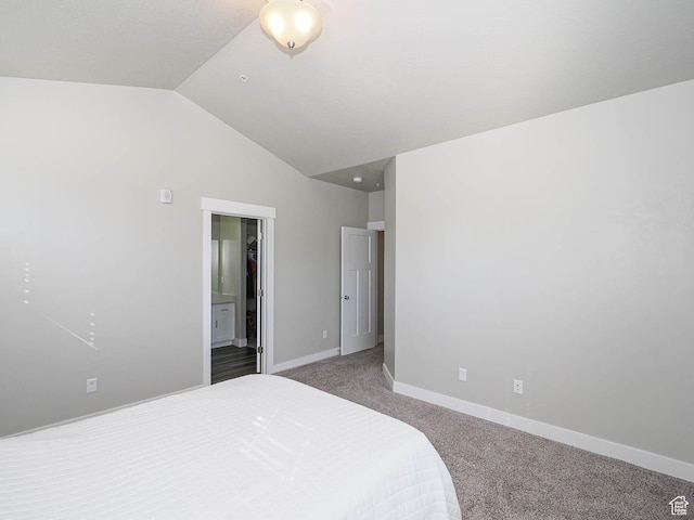14654 S Bloom Dr W Unit K 304, Herriman, UT 84096 - bedroom featuring carpet, vaulted ceiling, baseboards, and ensuite bathroom