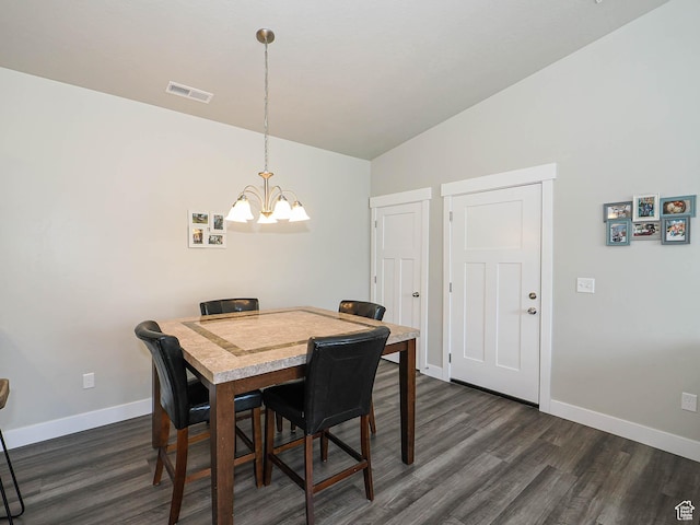 14654 S Bloom Dr W Unit K 304, Herriman, UT 84096 - dining space featuring a chandelier, dark wood finished floors, baseboards, and vaulted ceiling