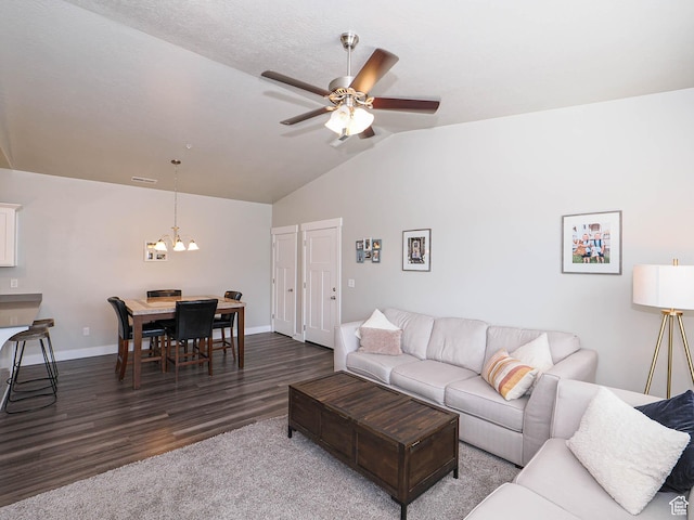 14654 S Bloom Dr W Unit K 304, Herriman, UT 84096 - living room with lofted ceiling, a chandelier, dark wood finished floors, ceiling fan, and baseboards