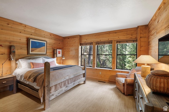 3057 E Balsam Rd, Sundance, UT 84604 - bedroom featuring multiple windows, wood walls, and light colored carpet