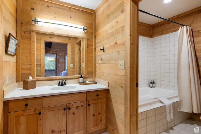 3057 E Balsam Rd, Sundance, UT 84604 - full bathroom featuring wooden walls, vanity, tiled shower / bath combo, and tile patterned flooring