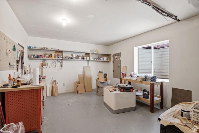 2193 E Robie Hill Ln, Millcreek, UT 84109 - miscellaneous room featuring concrete flooring and a workshop area